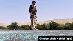 FILE - An Afghan soldier keeps watch during clashes with Islamic State (IS) militants in Kot district of Nangarhar province, Afghanistan, 26 June 2016. 